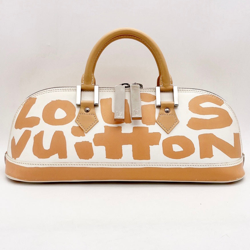 Alma graffiti leather handbag Louis Vuitton Beige in Leather